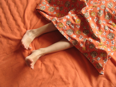 image of restless legs under covers